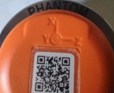 Axis orientation markings (X, Y, Z) embossed on top of Phantom sensor.